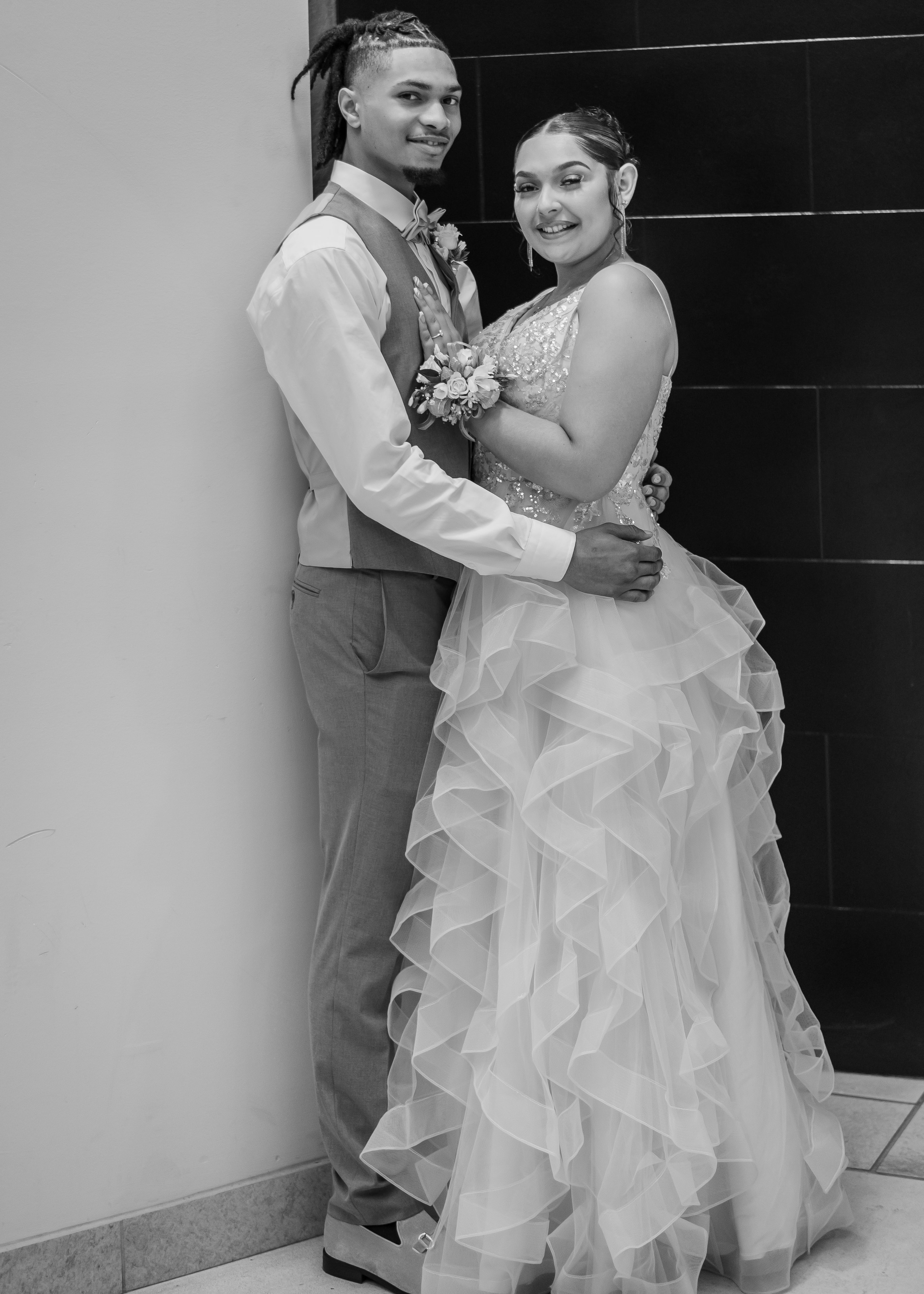 Senior couple in formal dance attire posing together